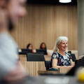 Photo of Professor Rhona Sharpe listening to a presentation