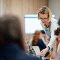 Photo of Dr Tünde Varga-Atkins working with delegates during her workshop