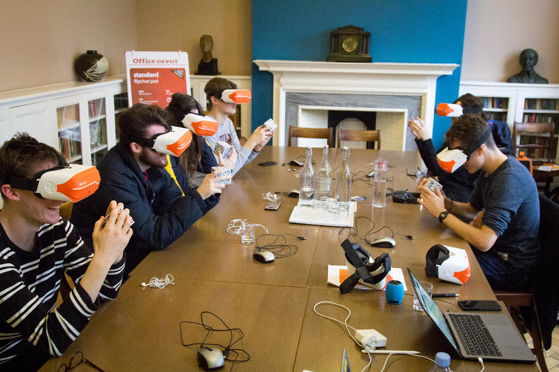 Lady Margaret Hall students handling objects using the ClassVR Virtual Reality headsets with QR cubes to virtually handle objects. Photo by Xavier L.