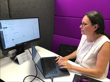 Marion Sadoux, Head of Modern Language Programmes at the University of Oxford Language Centre, working on a course in Canvas. Marion Sadoux working in Canvas on a laptop and larger screen.